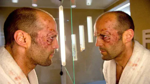 assets/jason-statham-s-beaten-joseph-smith-looking-at-himself-in-the-mirror-in-redemption.jpeg