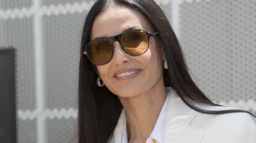 assets/demi-moore-smiling-while-wearing-sunglasses.jpeg