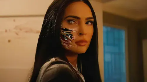 assets/megan-fox-with-a-robotic-face-under-her-skin-in-subservience.jpeg