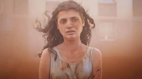 assets/a-girl-looks-worried-in-the-film-alpha.jpeg