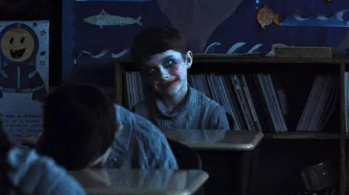 assets/creepy-kid-in-weapons.jpeg
