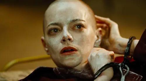 assets/emma-stone-sports-a-bald-head-in-the-movie-bugonia.jpeg