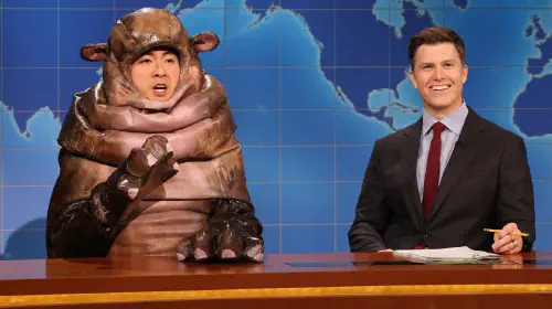 assets/bowen-yang-as-moo-deng-next-to-colin-jost-during-weekend-update-on-saturday-night-live.jpeg