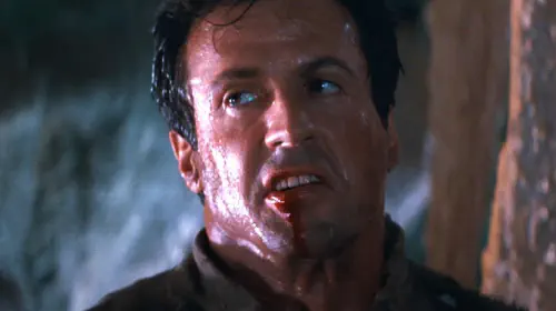 assets/sylvester-stallone-with-blood-gushing-from-his-mouth-in-cliffhanger.jpeg