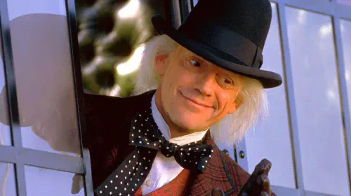 assets/christopher-lloyd-as-doc-brown-leaning-out-of-a-train-in-back-to-the-future-part-iii.jpeg