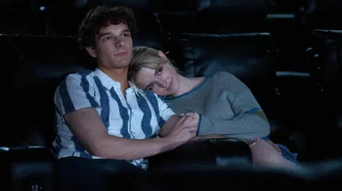 assets/mason-thames-and-mckenna-grace-snuggling-in-a-movie-theater-in-regretting-you.jpeg