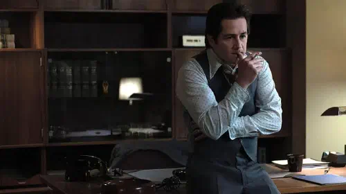 assets/michael-angarano-as-sam-amirante-looking-distraught-and-smoking-a-cigarette-in-his-office-in-devil-in-disguise-john-wayne-gacy.jpeg