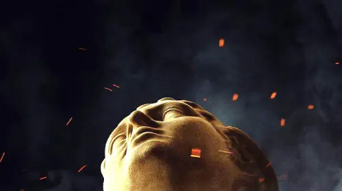 assets/a-statue-looking-upwards-as-ash-and-embers-fly-around-it-in-the-odyssey-poster.jpeg