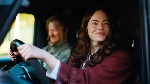 assets/emma-stone-driving-a-car-in-bugonia.jpeg