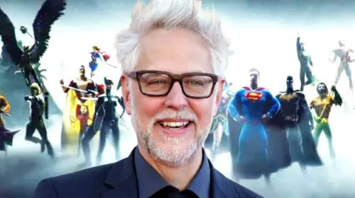 assets/james-gunn-with-the-dc-universe-behind-him.jpeg