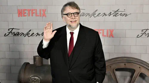assets/guillermo-del-toro-waving-his-hand-while-attending-the-frankenstein-premiere.jpeg
