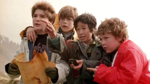 assets/four-of-the-goonies-about-to-embark-on-an-adventure.jpeg