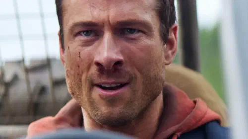 assets/glen-powell-about-to-drive-a-car-in-the-running-man.jpeg