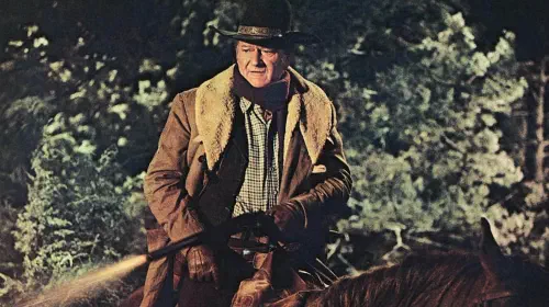 assets/john-wayne-as-us-marshal-jd-cahill-on-horseback.jpeg