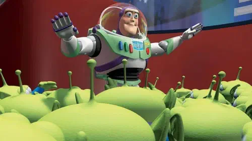 assets/buzz-lightyear-in-pixar-s-toy-story-next-to-little-grean-aliens-all-around-him-1.jpeg