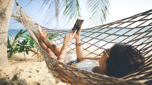 assets/esim-phone-hammock-shutterstock_1104305831-Peera-stockfoto.jpeg