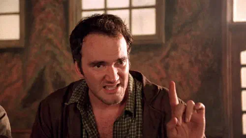 assets/quentin-tarantino-points-his-finger-up-in-desperado.jpeg
