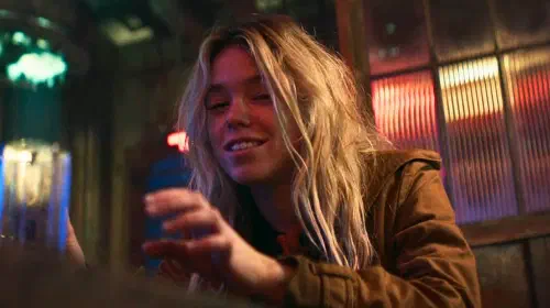 assets/milly-alcock-as-supergirl-at-a-bar.jpeg