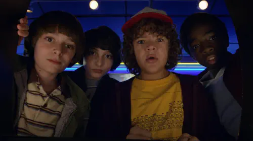 assets/will-mike-dustin-and-lucas-seen-from-the-point-of-view-of-a-screen-in-stranger-things-season-2.jpeg