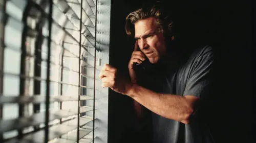 assets/jeff-bridges-looks-out-the-window-in-arlington-road.jpeg