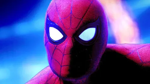 assets/tom-holland-s-spider-man-looks-at-the-camera-in-front-of-a-bright-blue-background-in-spider-man-no-way-home.jpeg
