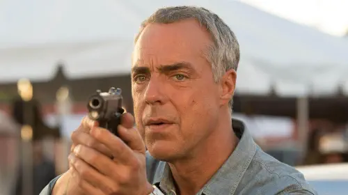 assets/titus-welliver-in-a-scene-from-bosch-as-harry-bosch-holding-a-gun.jpeg