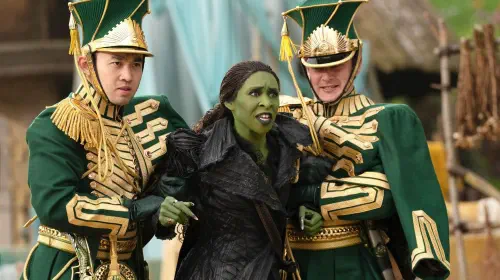 assets/two-ozian-guards-restraining-a-furious-elphaba-in-wicked-for-good.jpeg