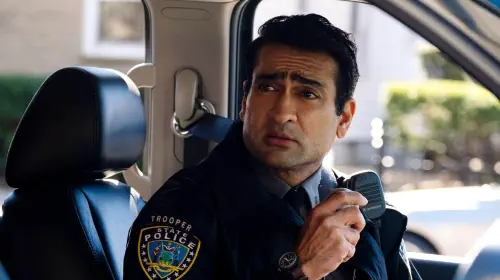 assets/kumail-nanjiani-looking-worried-as-a-police-officer-in-ella-mccay.jpeg