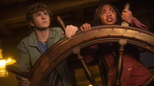 assets/percy-and-annabeth-steering-a-ship-in-percy-jackson-and-the-olympians-season-2.jpeg