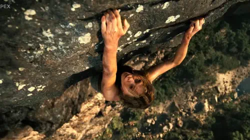 assets/charlize-theron-climbing-a-mountain-in-apex.jpeg