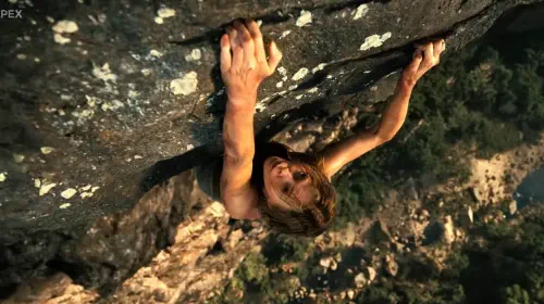 assets/charlize-theron-climbing-a-mountain-in-apex.jpeg