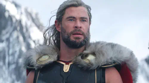 assets/chris-hemsworth-s-thor-looking-at-the-distance-in-the-snow-in-thor-love-and-thunder.jpeg