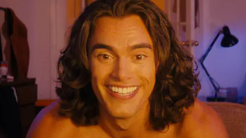 assets/a-man-with-long-hair-smiling-broadly-in-the-beauty.jpeg