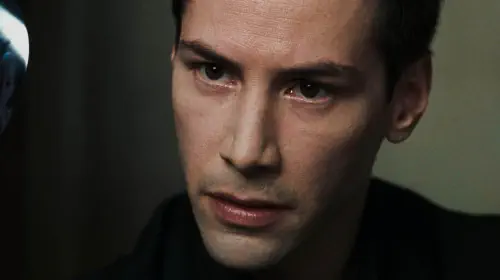 assets/keanu-reeves-in-the-matrix-looking-forward.jpeg