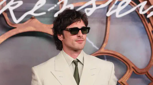 assets/jacob-elordi-in-a-light-suit-and-sunglasses-at-a-red-carpet-event.jpeg