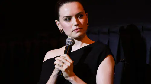 assets/daisy-ridley-holding-a-microphone.jpeg