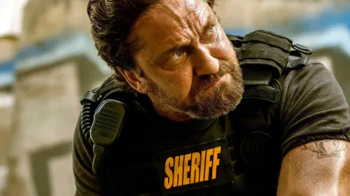 assets/gerard-butler-as-big-nick-looking-angry-in-den-of-thieves.jpeg