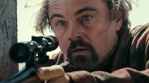 assets/bob-in-close-up-looking-shocked-as-he-holds-his-rifle-in-one-battle-after-another.jpeg
