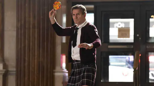 assets/liam-neeson-in-a-schoolgirl-outfit-holding-a-lollipop-angry-in-the-naked-gun-2025.jpeg