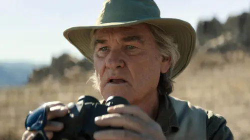 assets/kurt-russell-as-lee-shawn-with-binoculars-in-monarch-legacy-of-monsters.jpeg