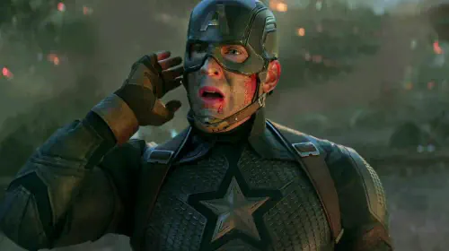 assets/chris-evans-captain-america-getting-a-call-with-his-arm-flexed-in-avengers-endgame.jpeg