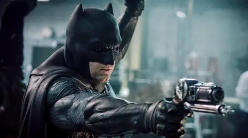 assets/ben-affleck-as-batman-holding-out-a-gun-in-batman-v-superman-dawn-of-justice.jpeg