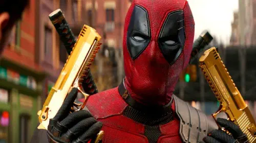 assets/ryan-reynolds-deadpool-with-golden-pistols-in-deadpool-wolverine.jpeg