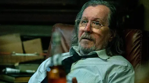 assets/gary-oldman-s-jackson-lamb-looking-worried-while-sitting-in-a-chair-in-slow-horses-season-5.jpeg