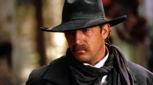 assets/kevin-costner-as-wyatt-looking-intensely-at-something-in-wyatt-earp.jpeg