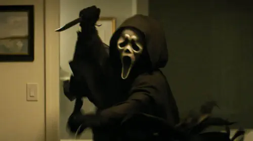 assets/scream-7-ghostface-holding-his-knife-about-to-stab.jpeg