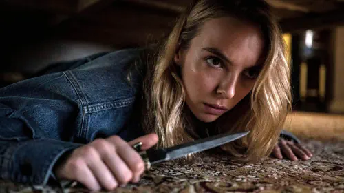 assets/jodie-comer-under-a-bed-with-a-knife-in-killing-eve.jpeg