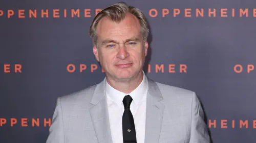 assets/christopher-nolan-straight-faced-while-posing-at-a-red-carpet-event.jpeg