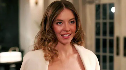 assets/sydney-sweeney-s-millie-at-the-hotel-reception-desk-in-the-housemaid.jpeg