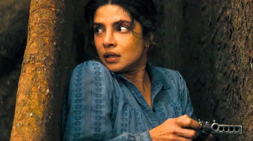 assets/priyanka-chopra-jonas-hiding-behind-a-tree-to-reload-in-the-bluff.jpeg